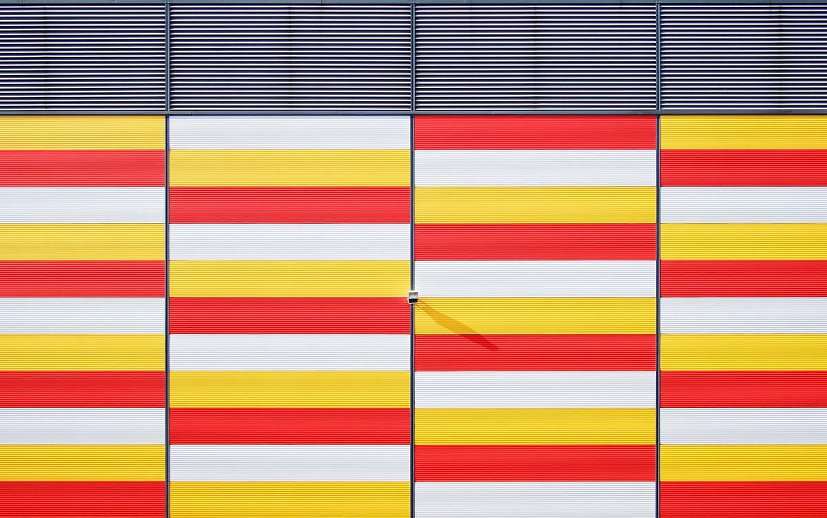 architecture white, red, and yellow striped bars background