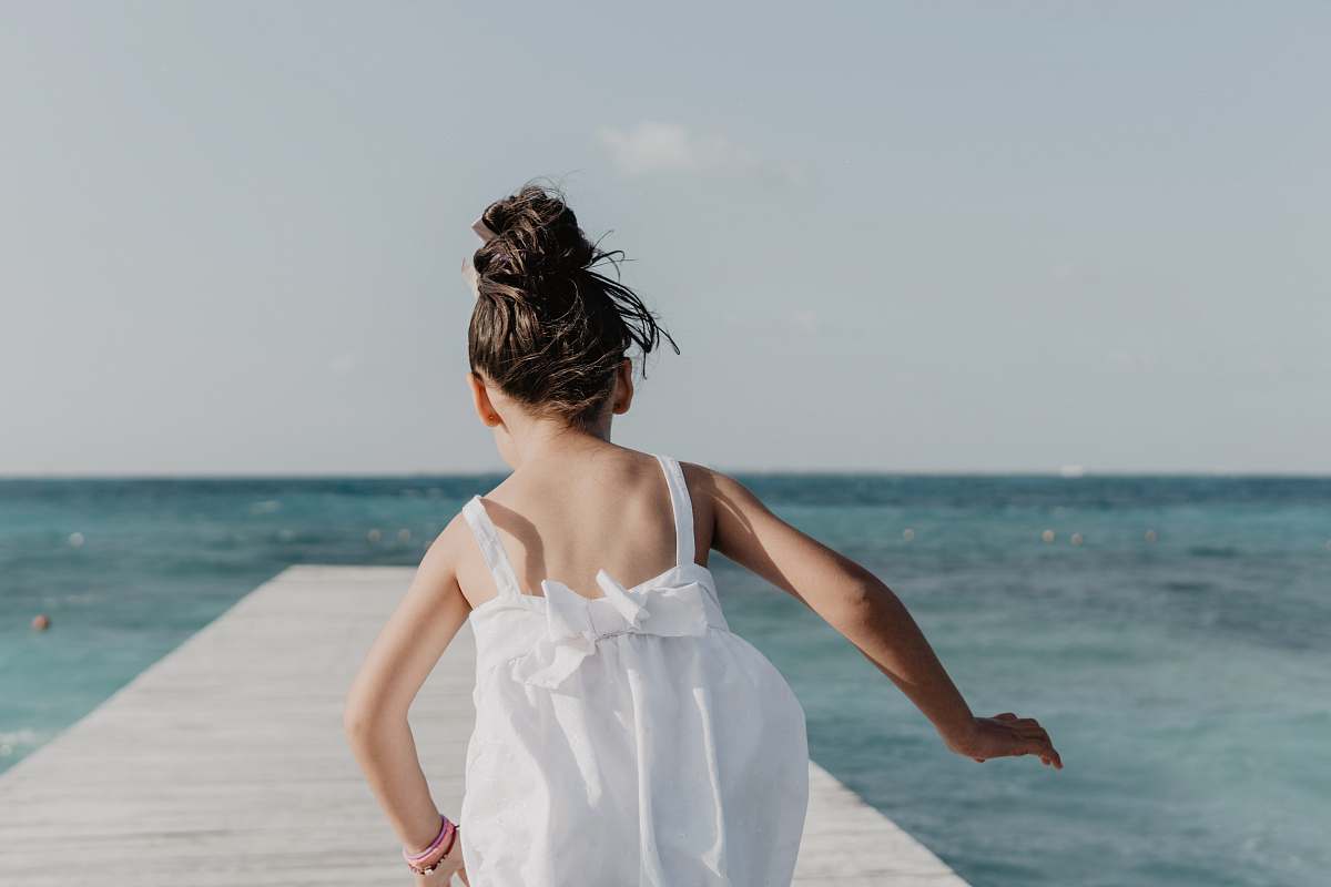 person girl running on dock under white sky human