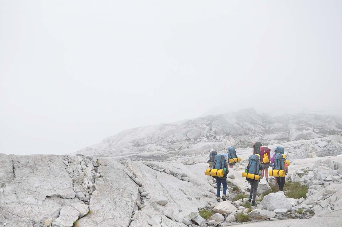 human group of people hiking on moutain person
