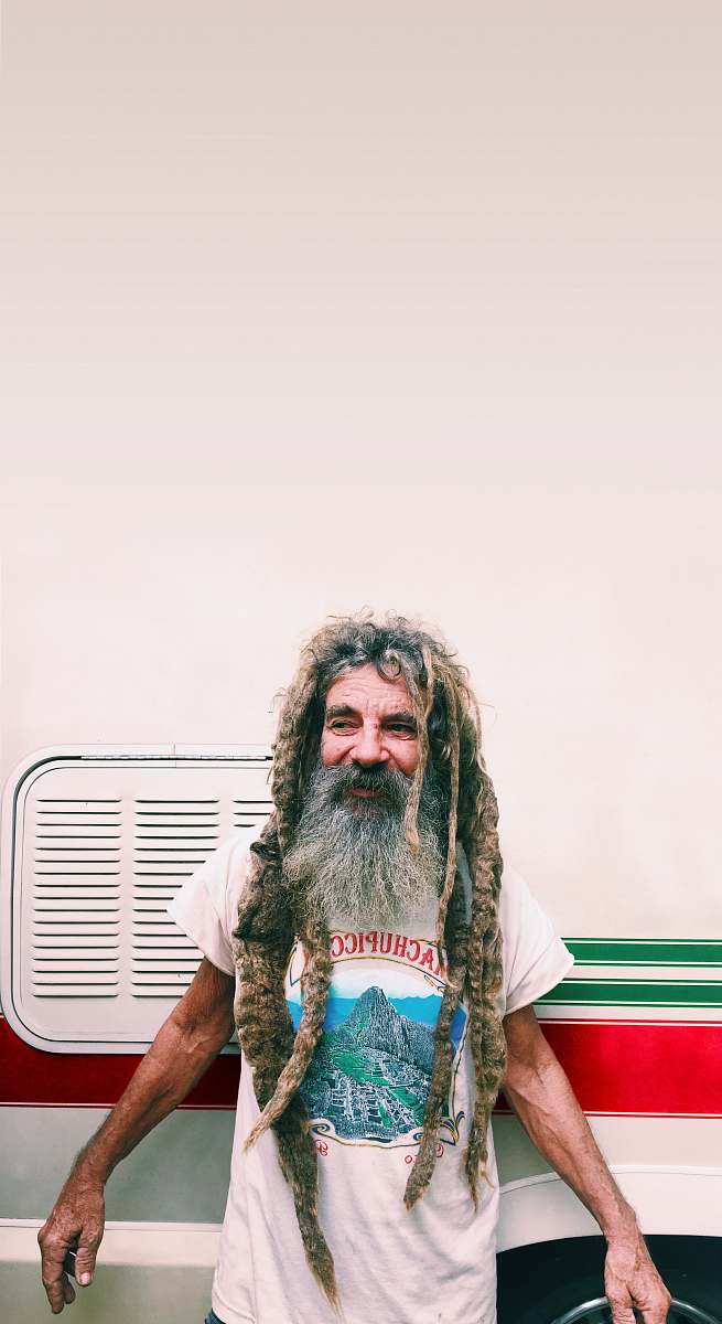 human man standing in front of vehicle person