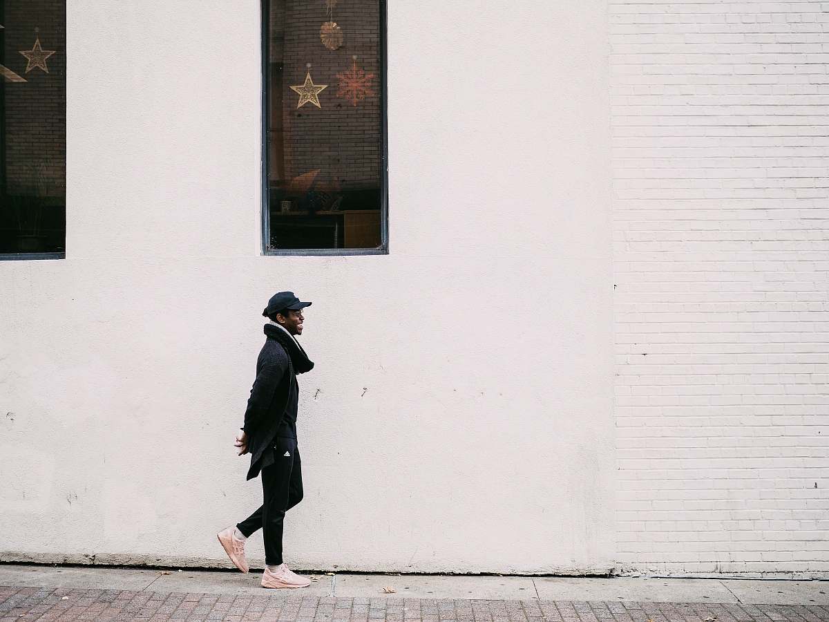 person man walking on street human