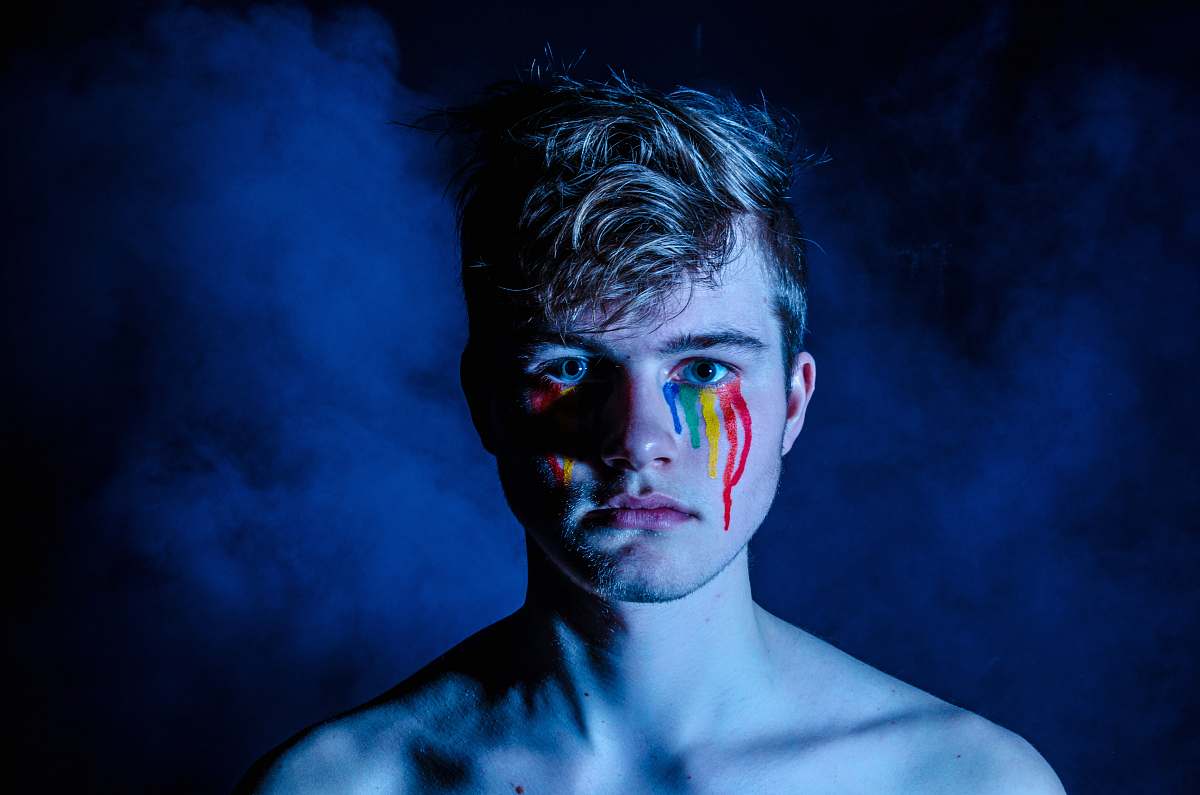 person photo of man crying with colored tears human