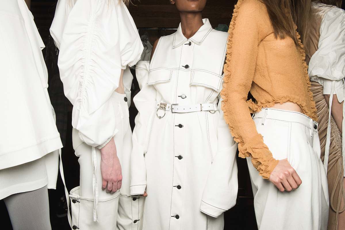 human women's white button-up coat person
