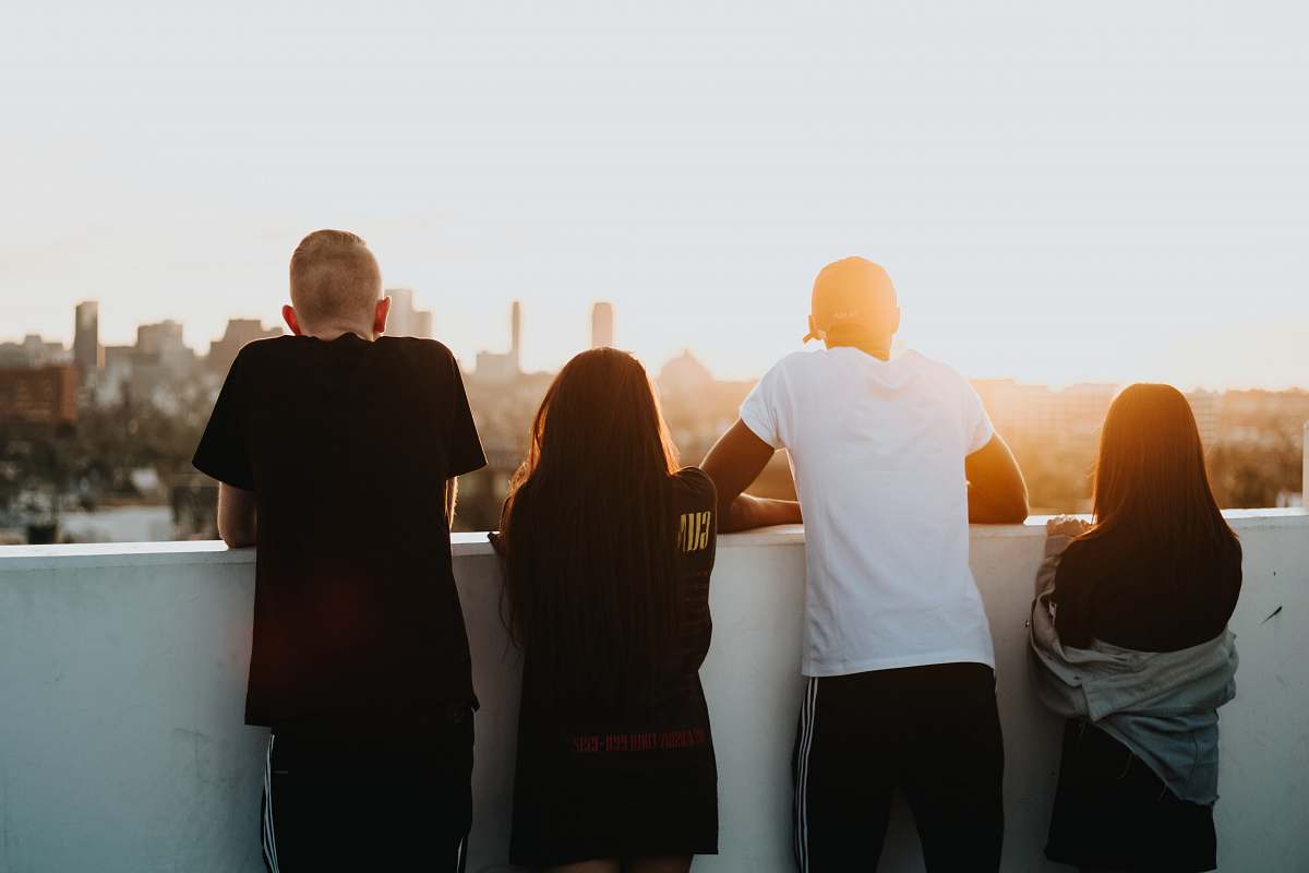 human four person looking at the city people