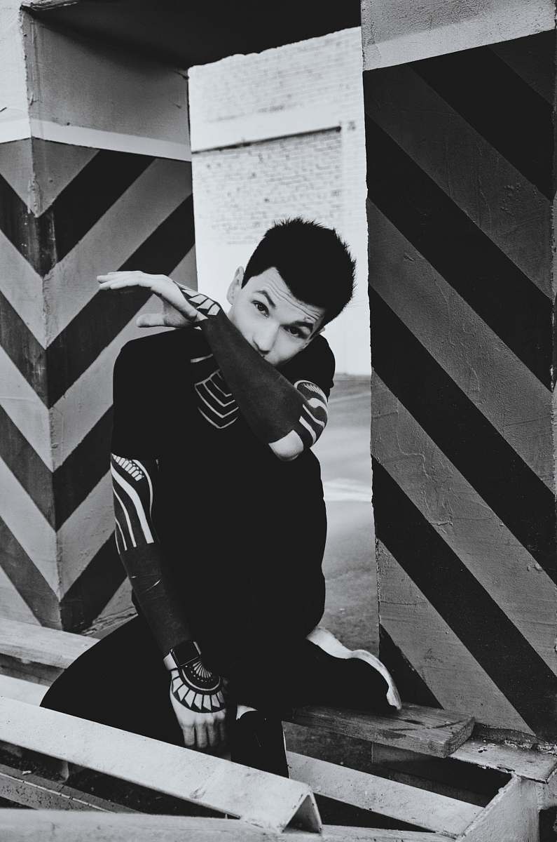 human grayscale photo of man with sleeve tattoos people