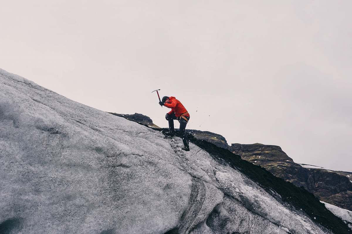 climbing man climbing on mountain during daytime human