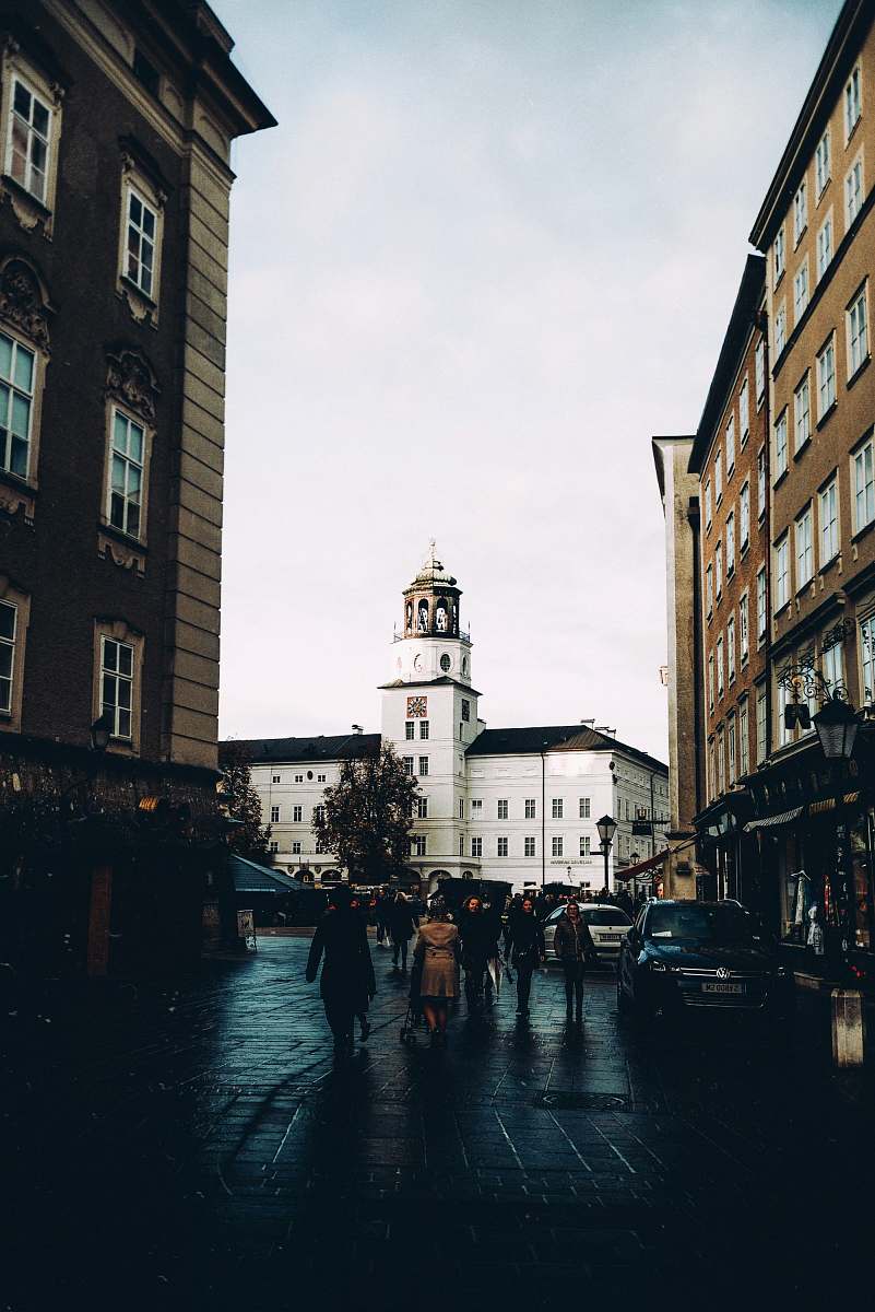 human people standing beside buildings pedestrian