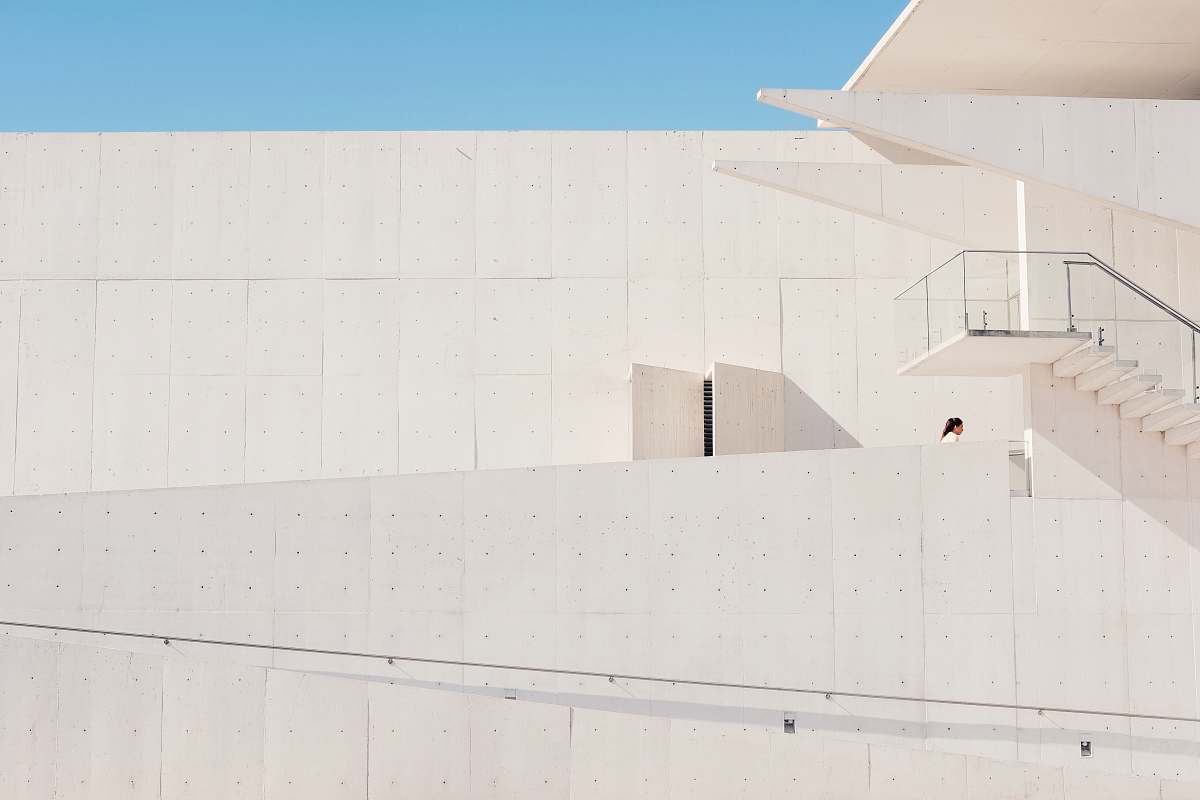 architecture person inside white concrete building building