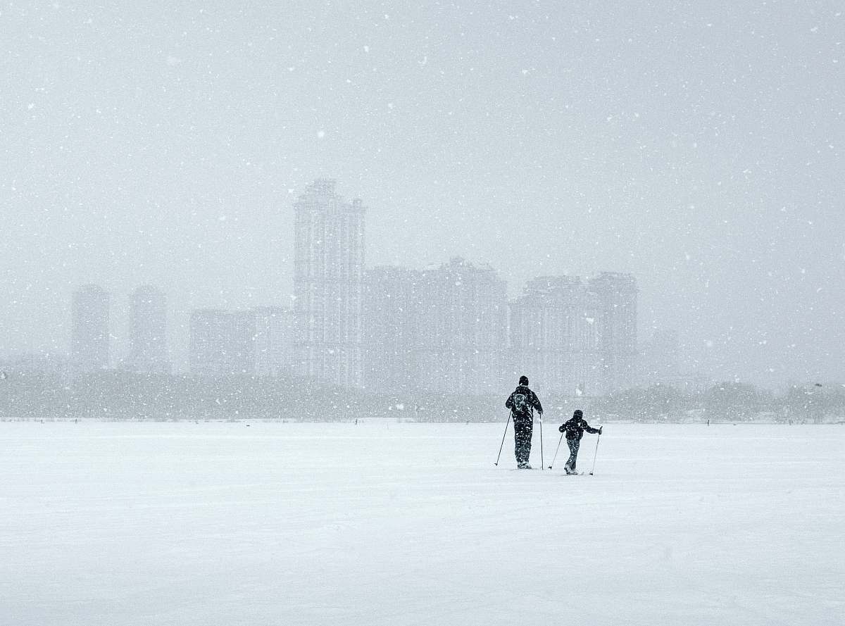 snow two persons walking on snow winter
