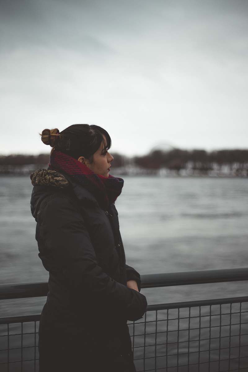 human woman standing next to fence people