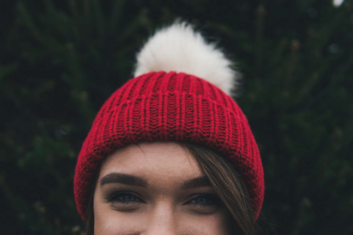 hat woman wearing red bobble hat beanie