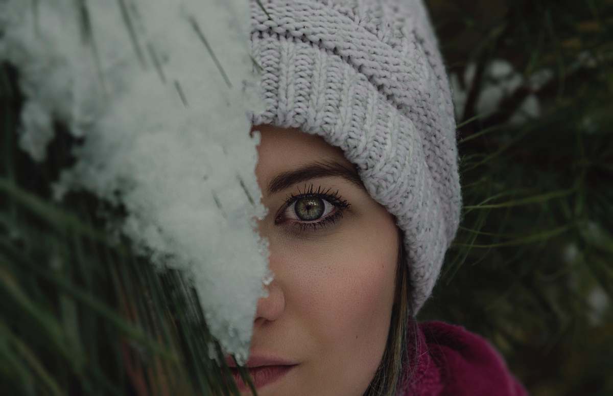 clothing woman's face covered by green plant people