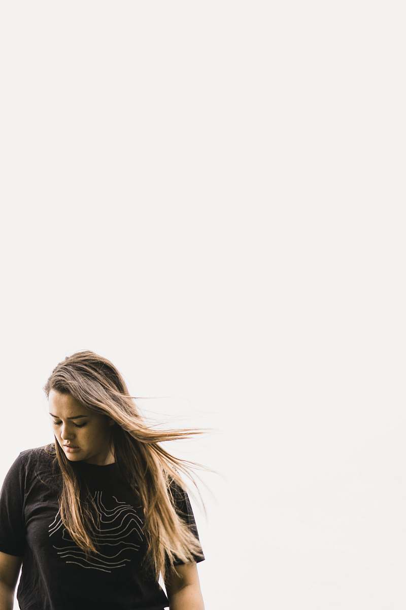human women's black shirt under white sky apparel