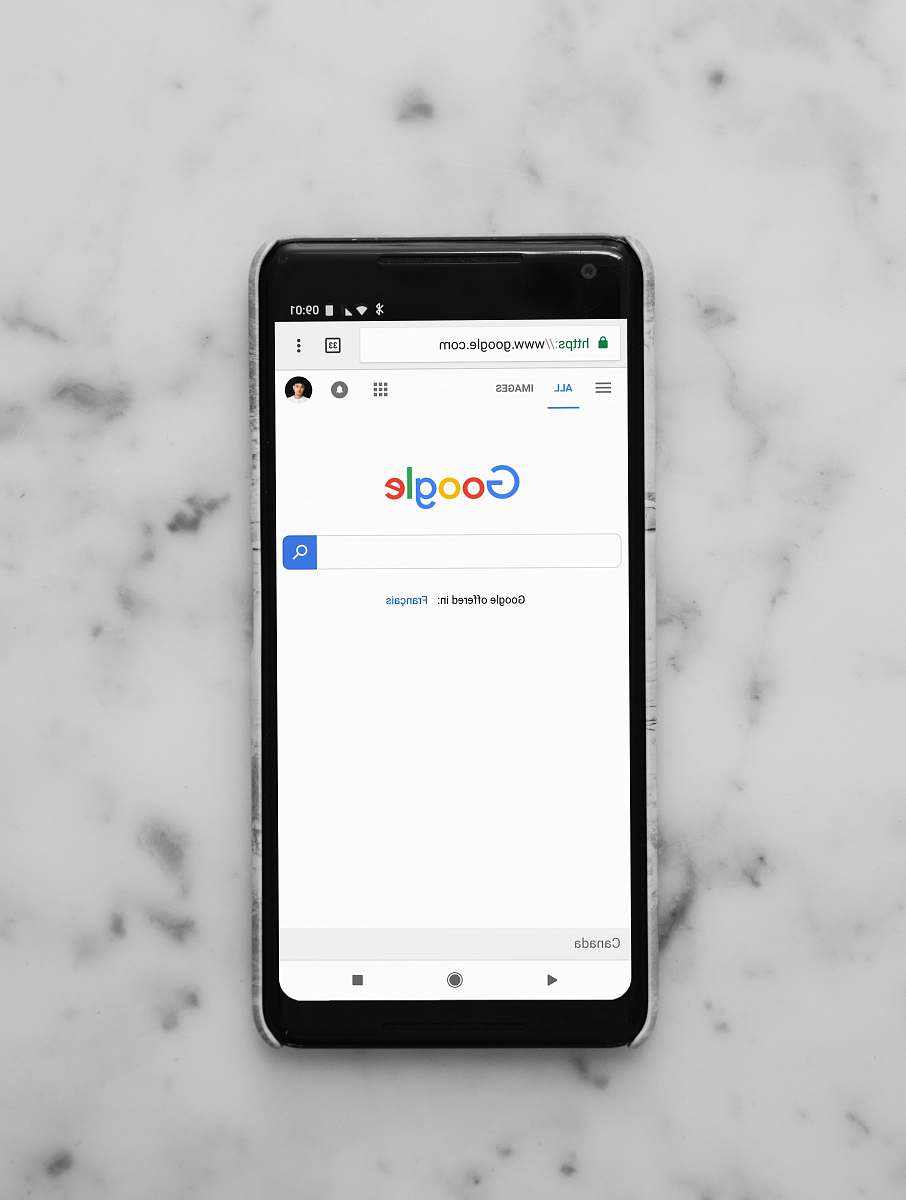 white black Android smartphone showing google site on white surface google