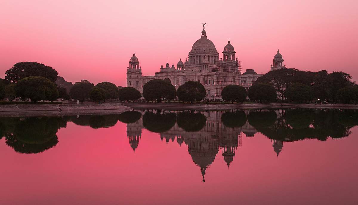 india white concrete castle near body of water dome