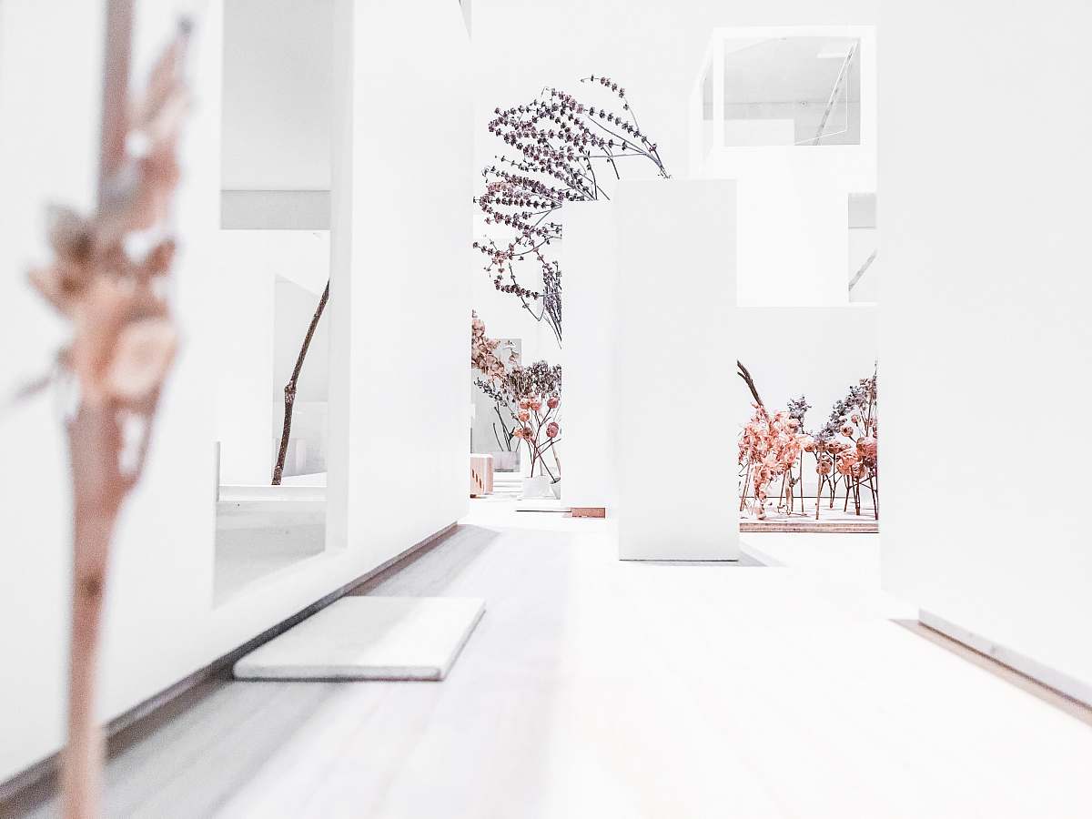 paper hallway near concrete pillar vase