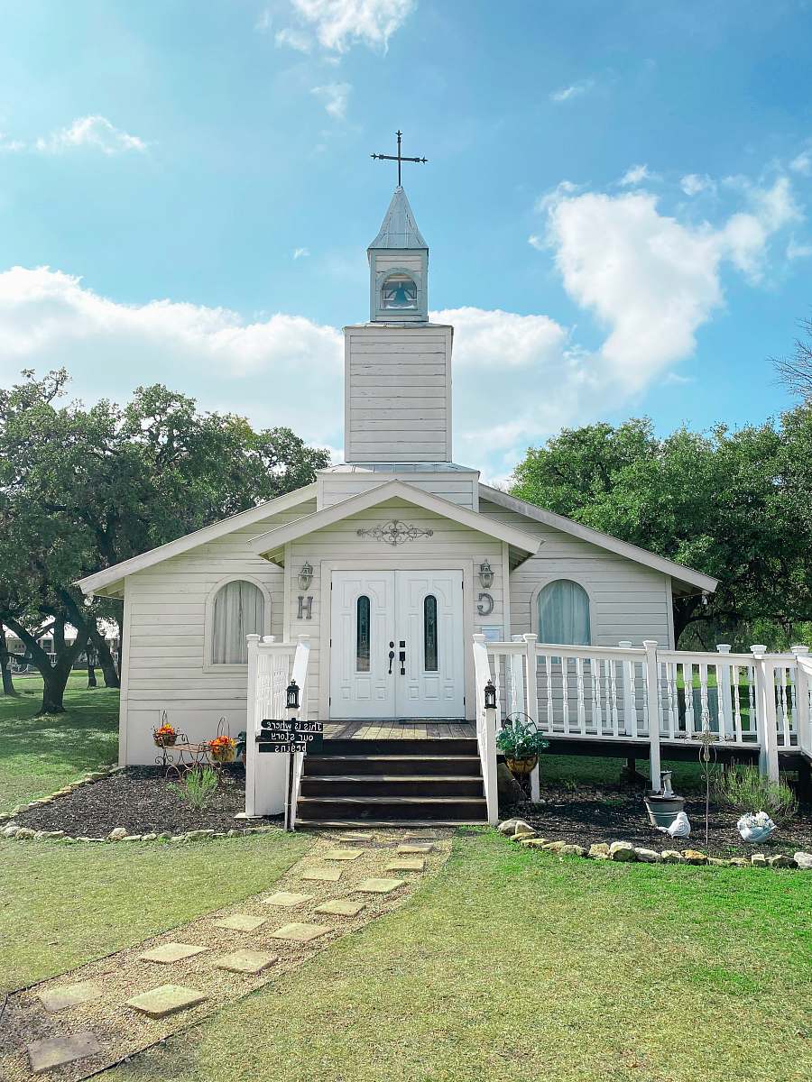 grass white church near trees church