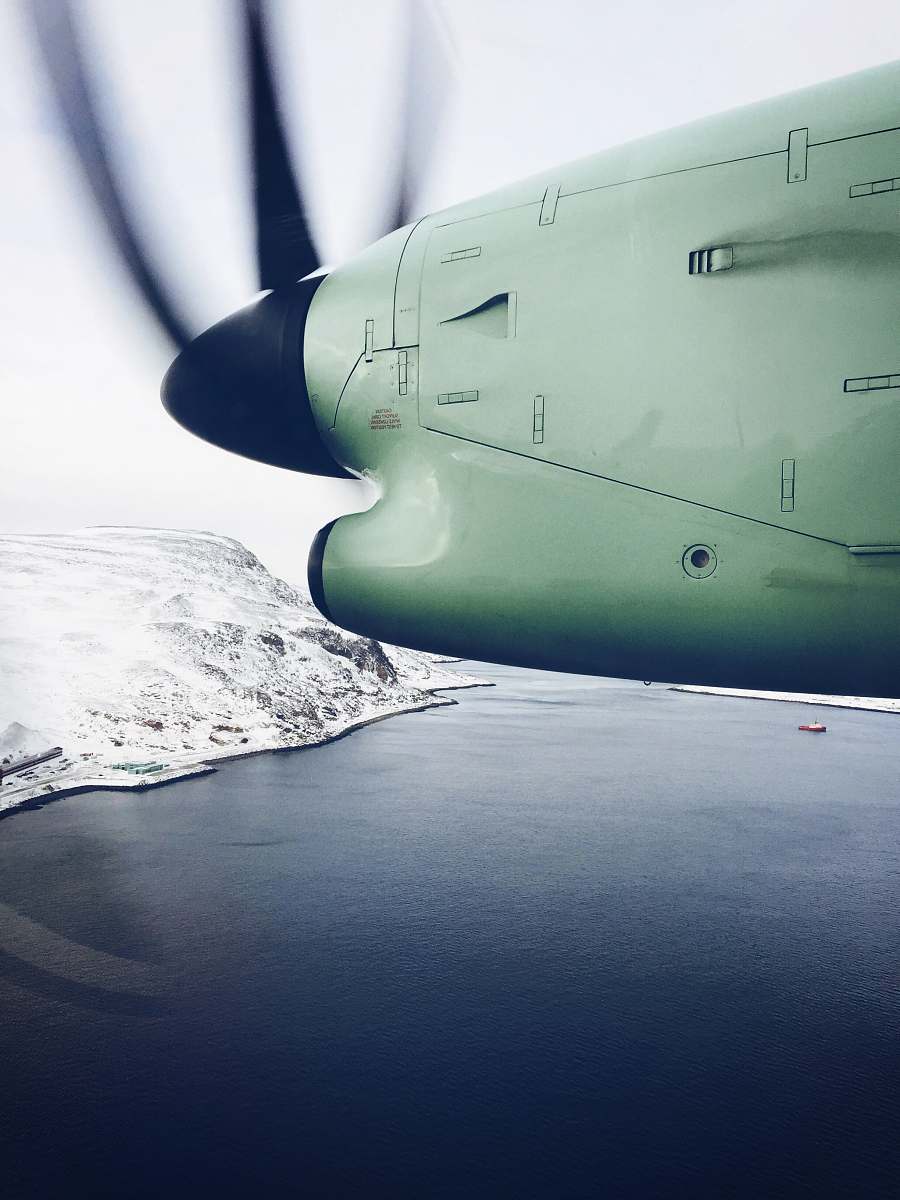 norway white plane flying over lake hammerfest