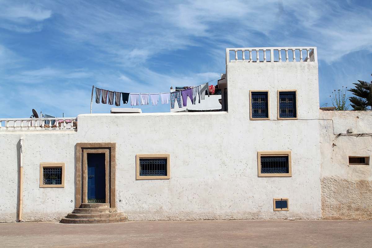 morocco white and grey concrete house under blue sky facade