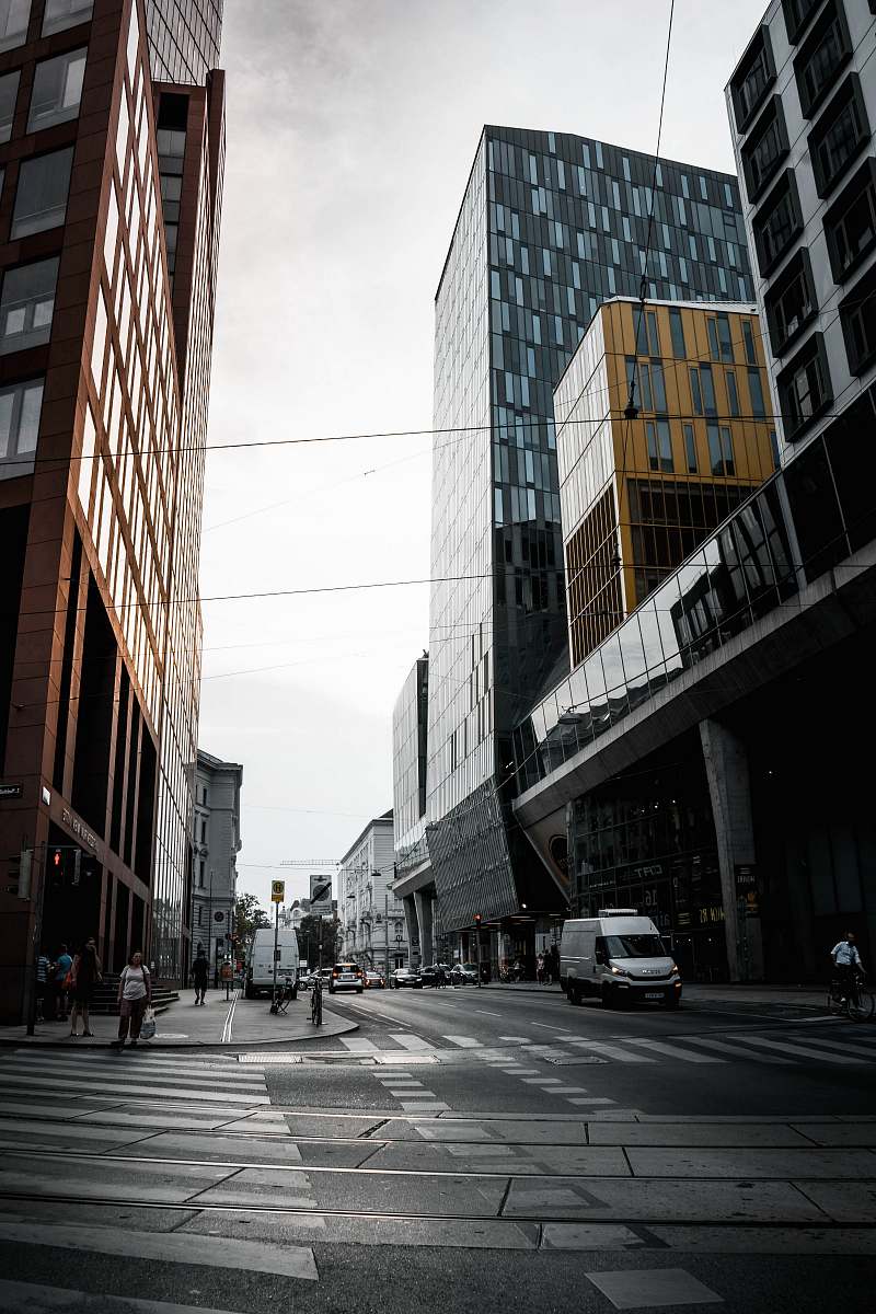 asphalt van crossing between buildings tarmac
