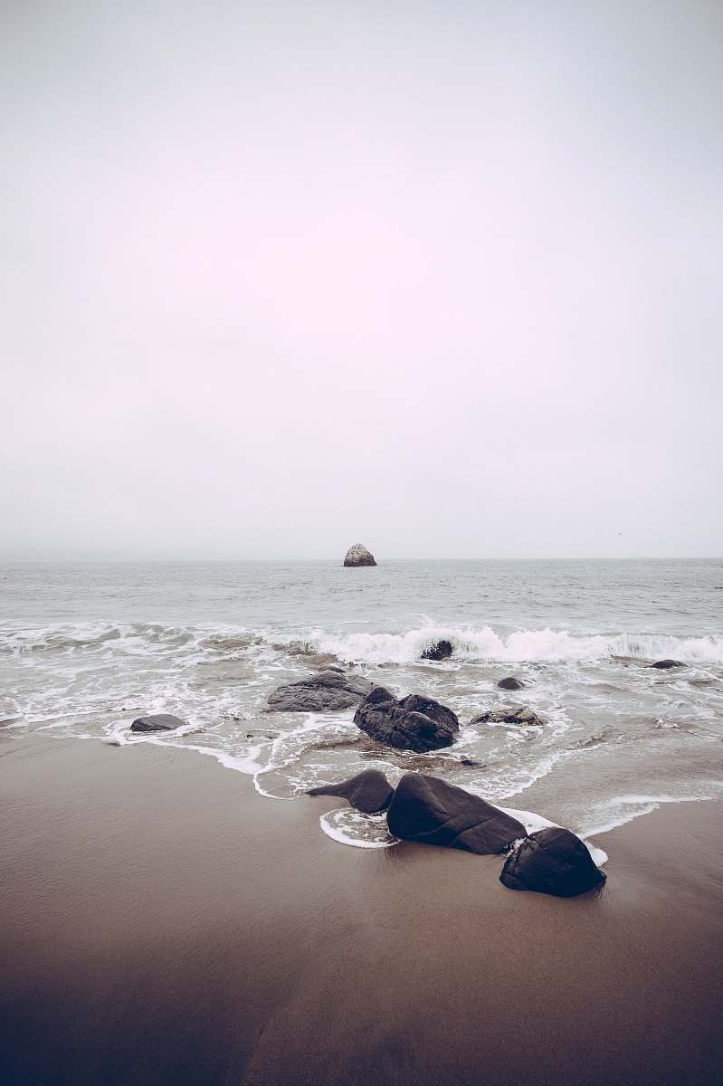 sea rocks on sea side at daytime beach