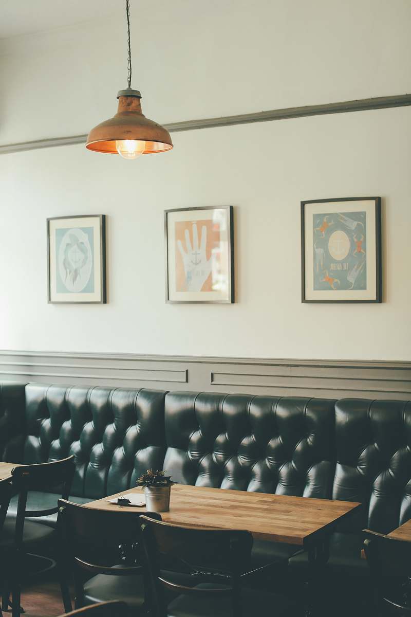 chair photo of dining set and leather sofa inside a room with pendant lamp light fixture