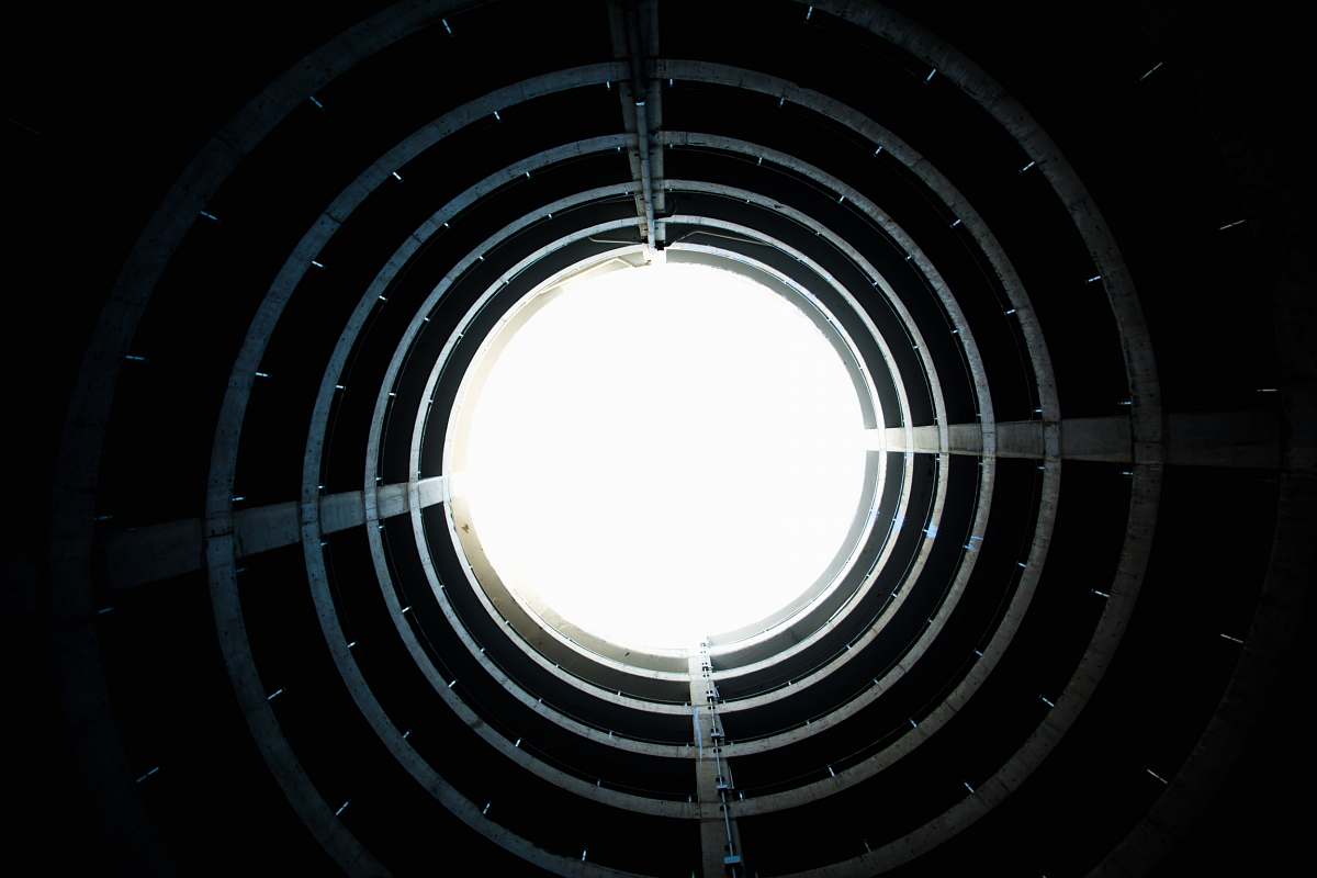 circle low-angle photography of tunnel looking up