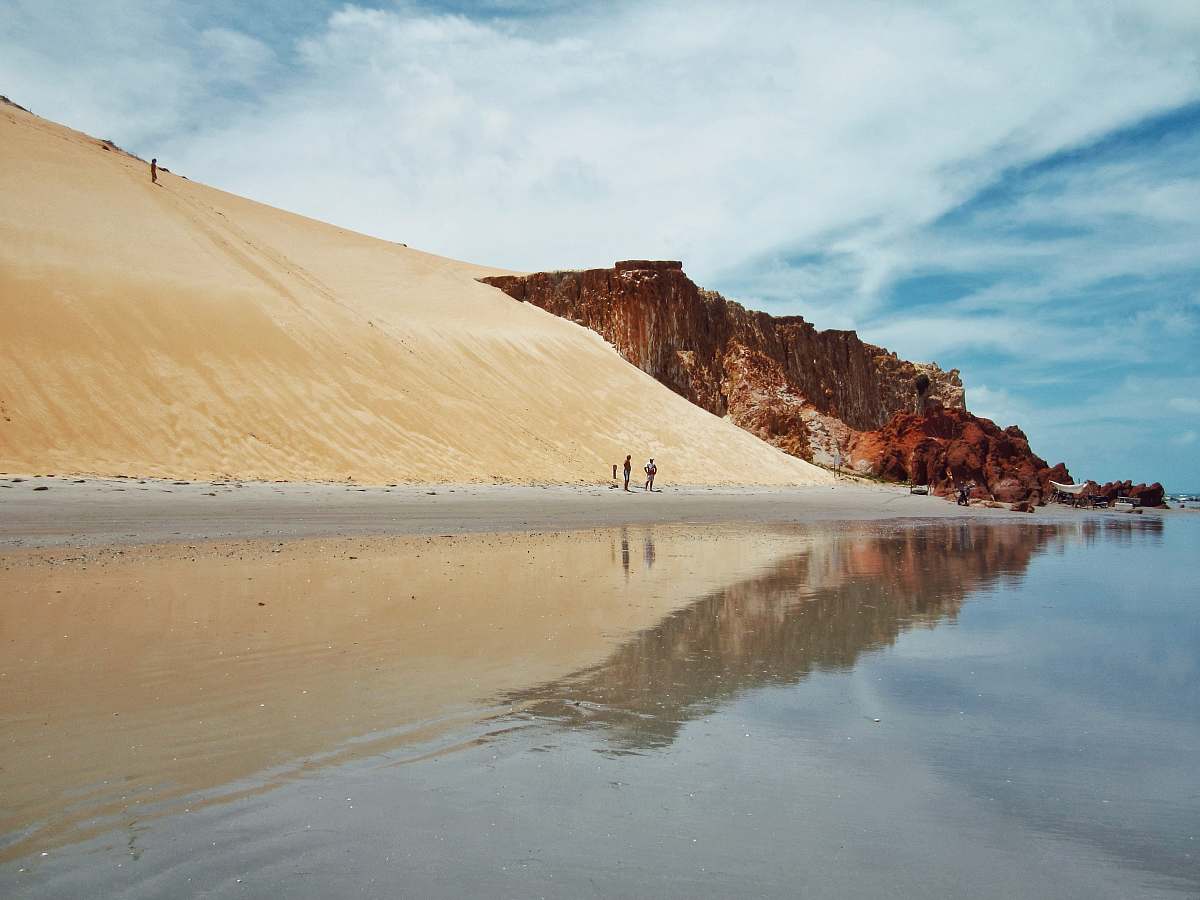 water people walking beside oasis during daytime landscape