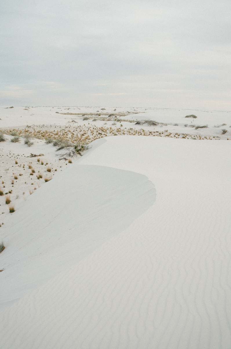 dune snowfield during cloudy sky white sands national monument