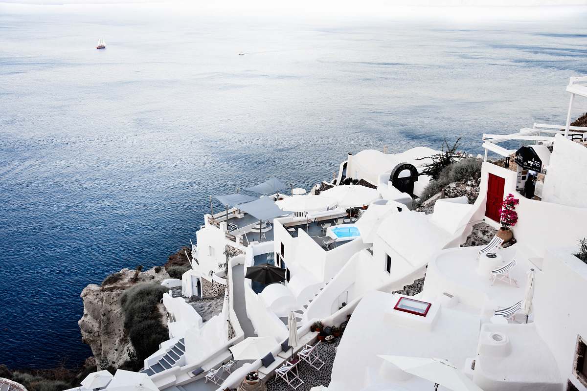 greece aerial photography of house near sea ocean
