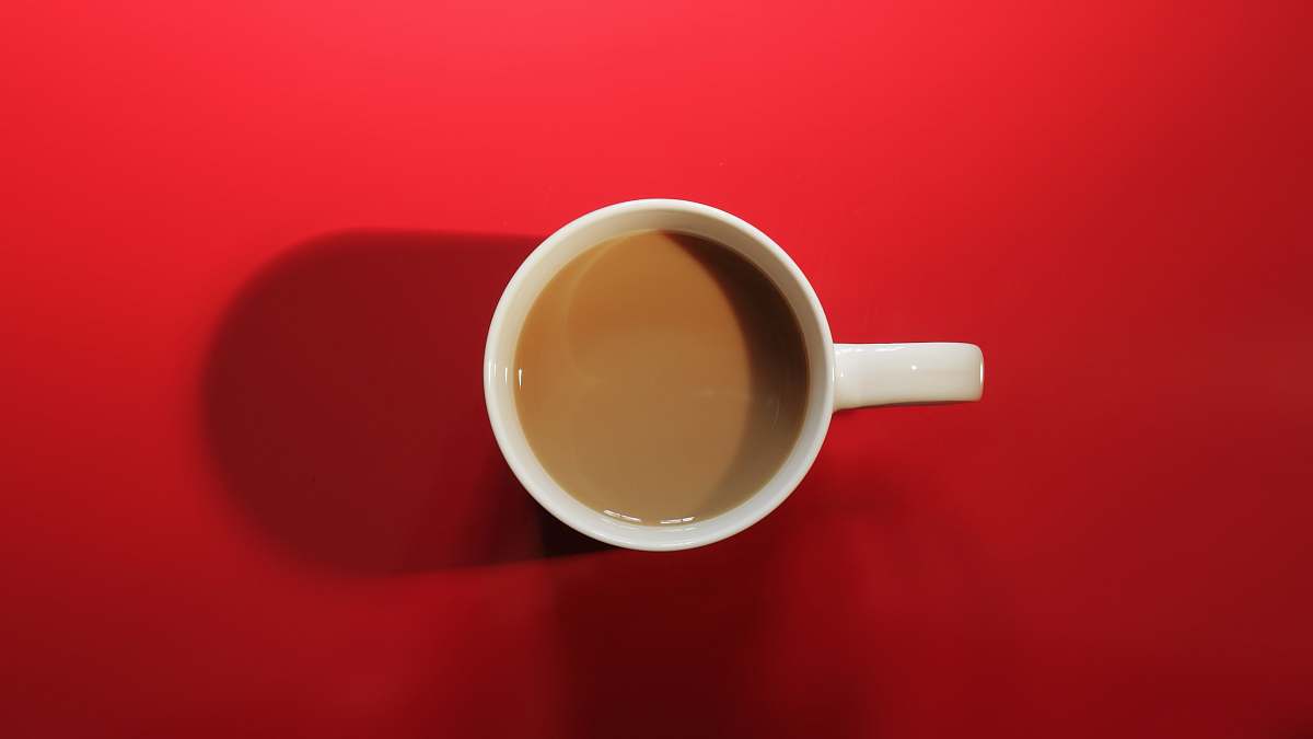 cup white ceramic mug filled with coffee red