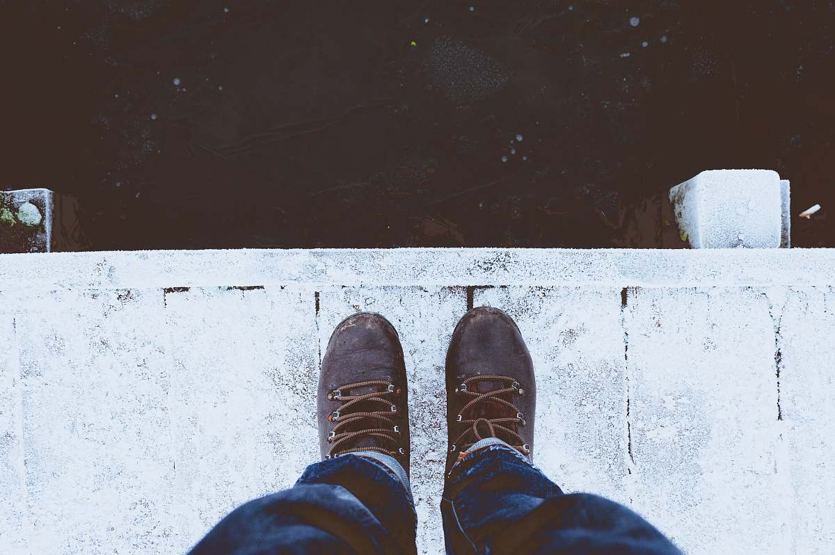 boot person standing white floor ice