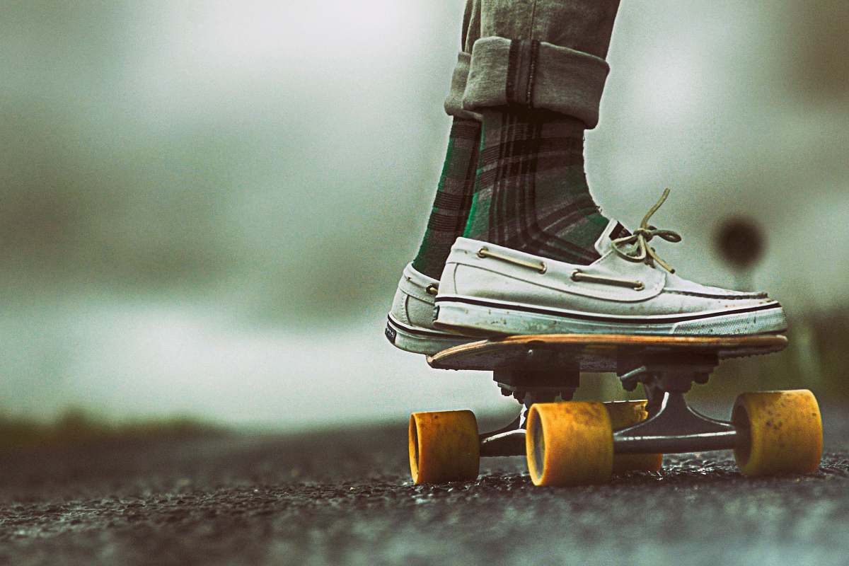 turkey person standing on skateboard during daytime wheels