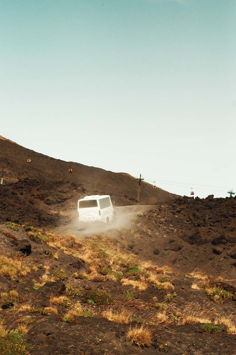 etna white van in a hill during daytime sicily