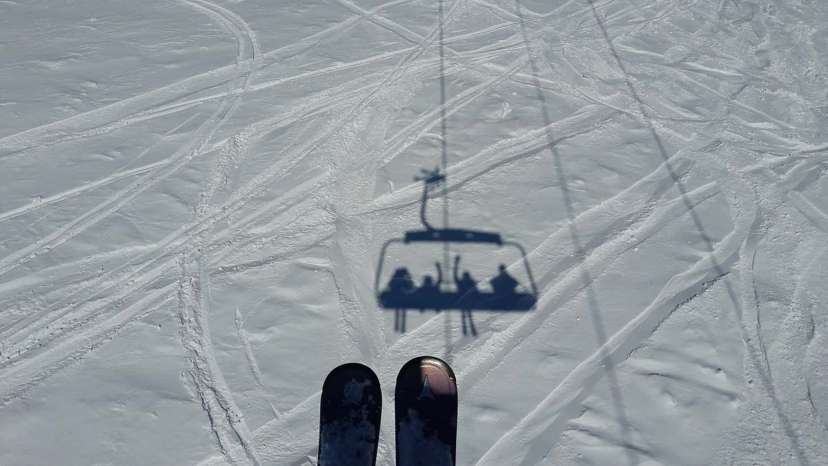 gudauri aerial photography of ski lift shadow on snow field during day georgia