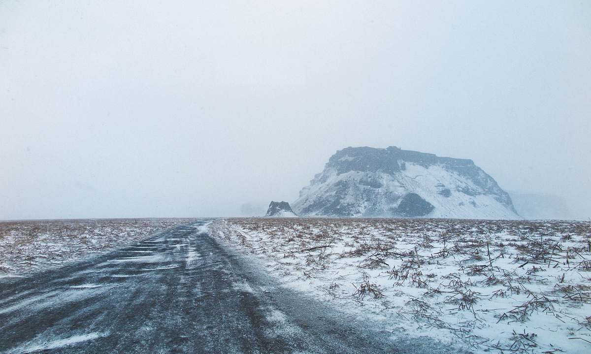 storm brown mountains covered with snow cold