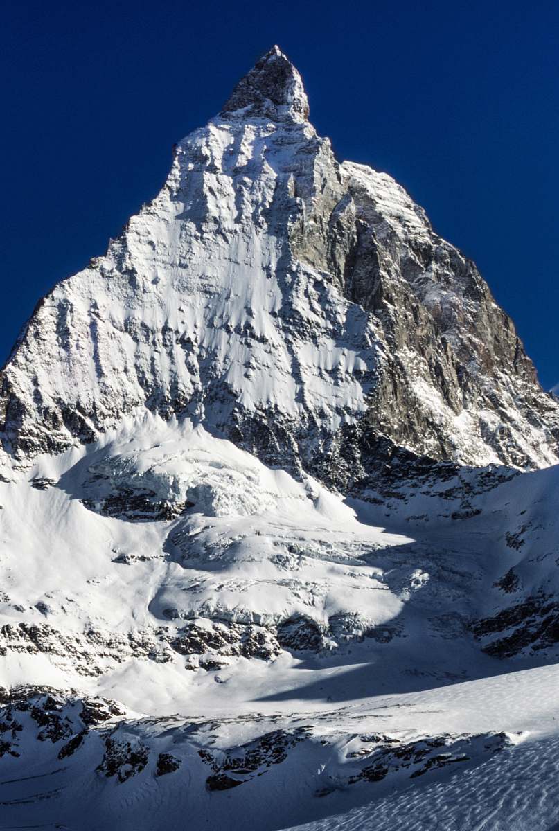 mountain gray mountain covered by snow peak
