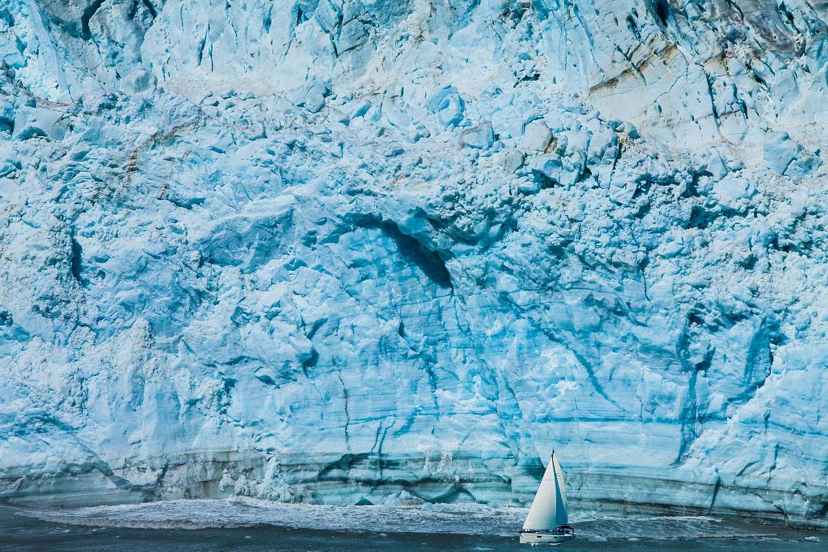 nature white sailboat near mountain glacier