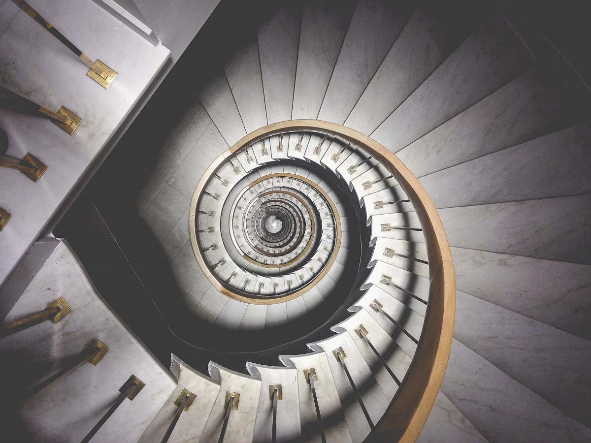 spiral photo of spiral white stairs architecture
