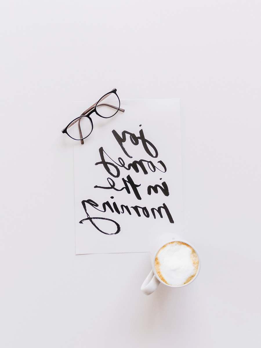 handwriting black-framed eyeglasses calligraphy