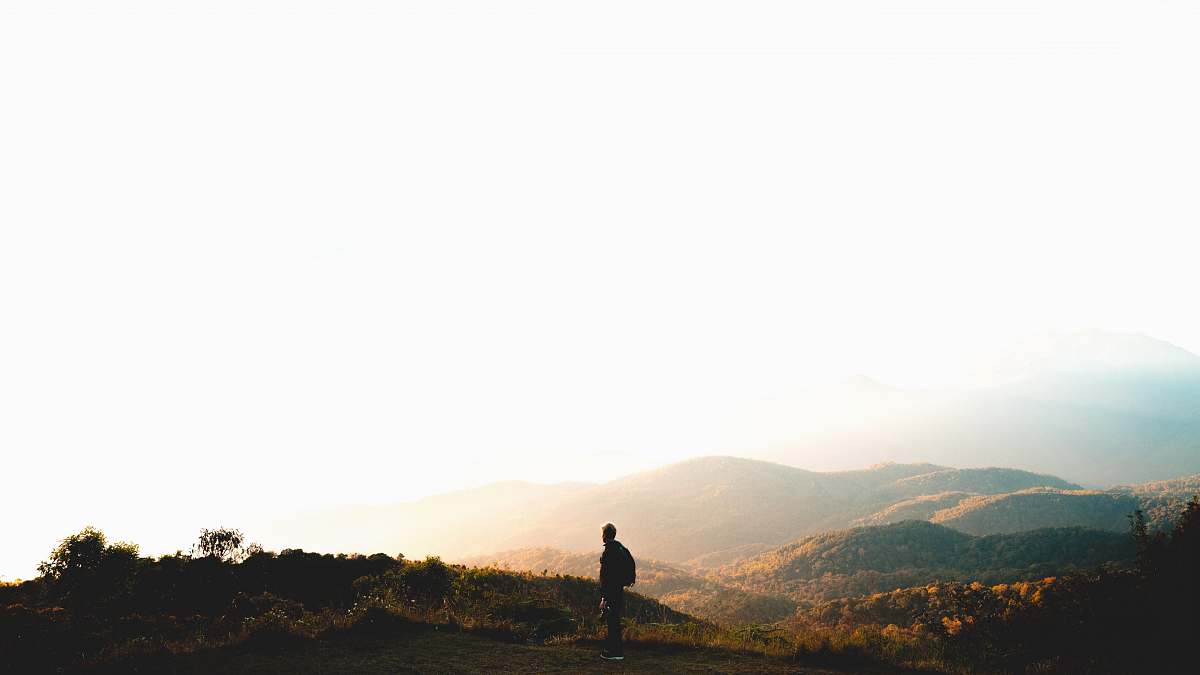 sky man standing near mountain under cloudy sky at daytime chiang mai