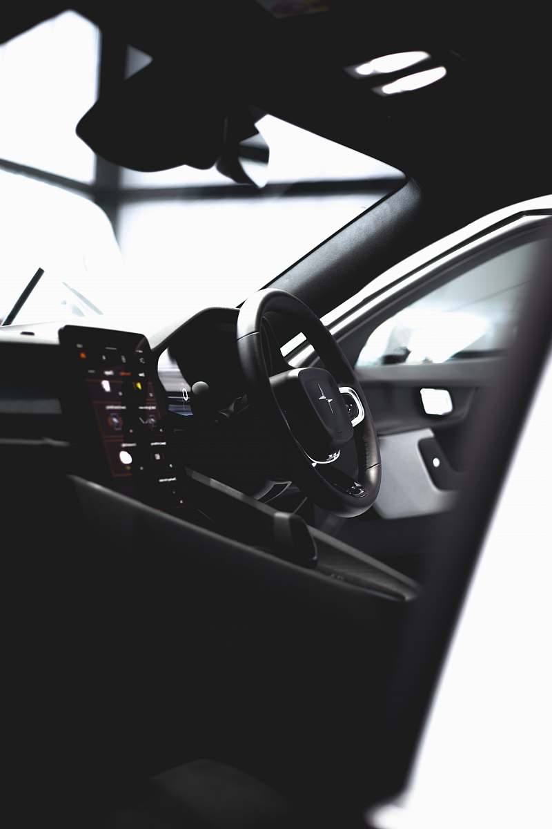 Capture the essence of modern remote work with this dynamic image of a man diligently working on his laptop inside a car, set against the stunning backdrop of Canada's picturesque landscapes. This scene exemplifies the fusion of technology and nature, making it ideal for articles about remote work, travel, and the digital nomad lifestyle. Perfect for use in blogs, marketing materials, or promotional content focused on productivity and the great outdoors.