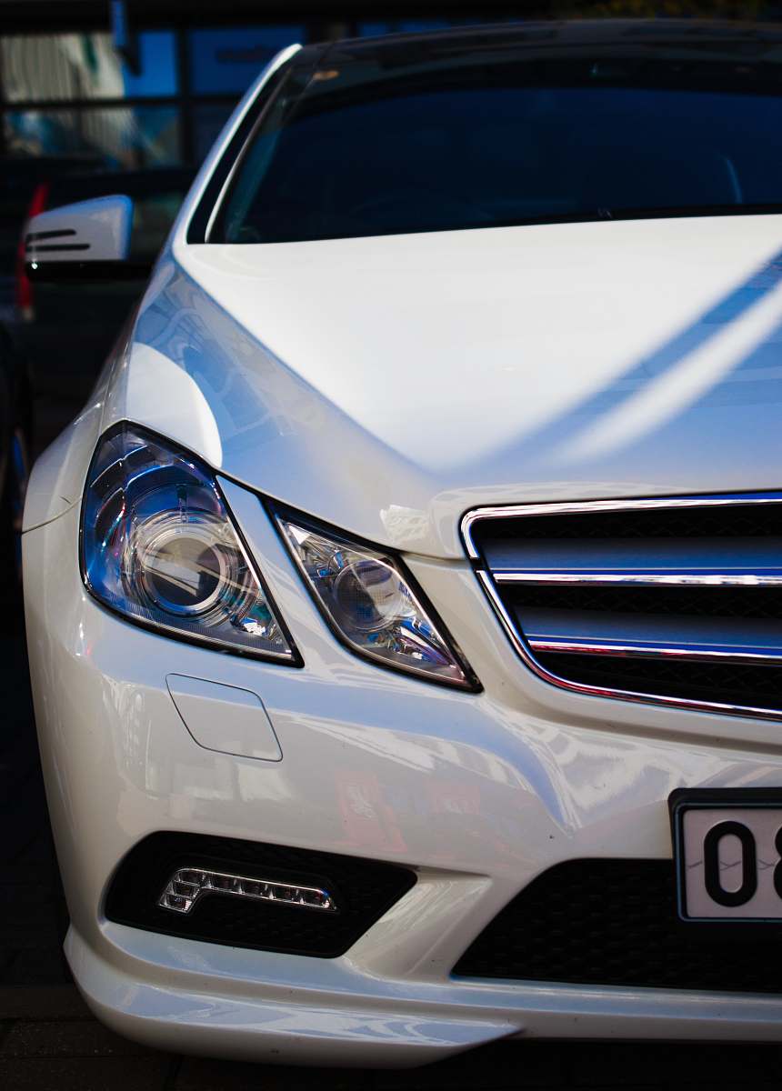 car close view of white vehicle automobile
