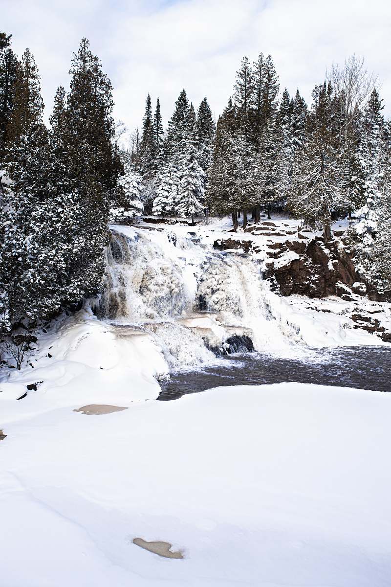 fir waterfalls between trees abies