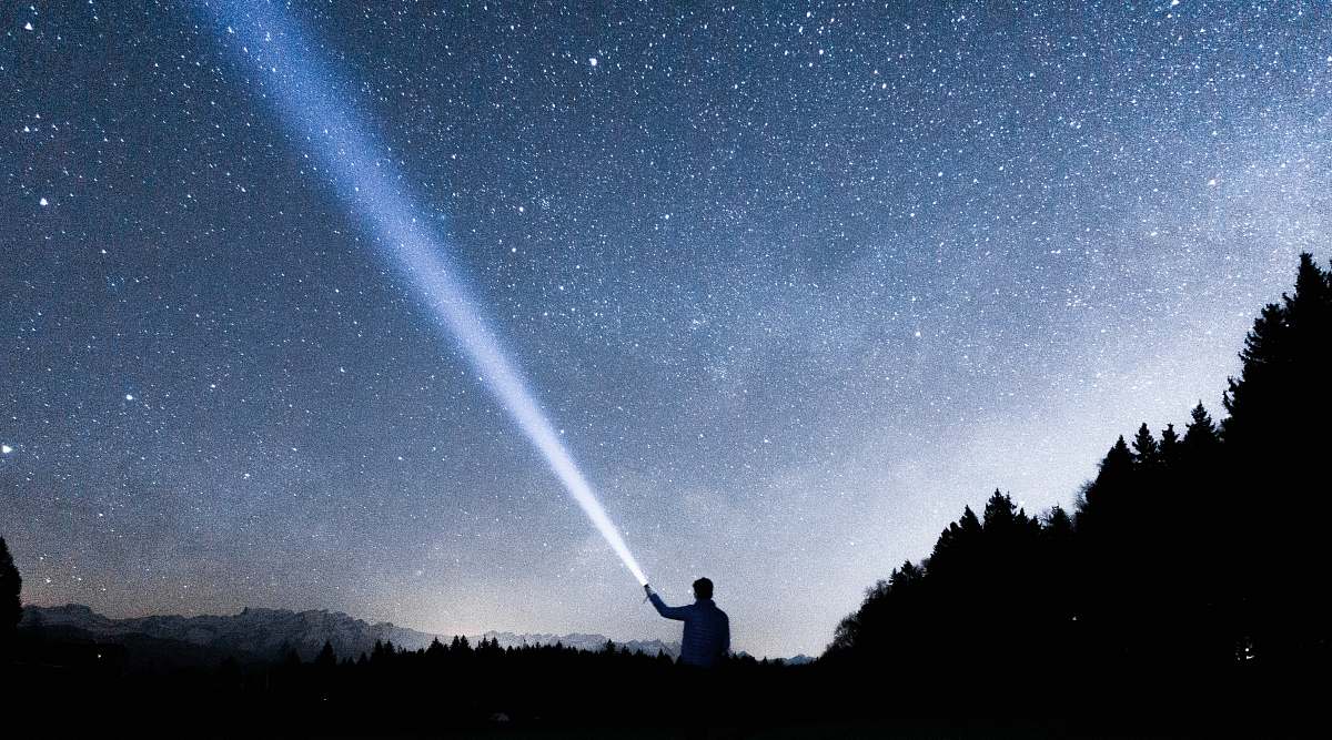 switzerland silhouette of person holding flashlight during nighttime night