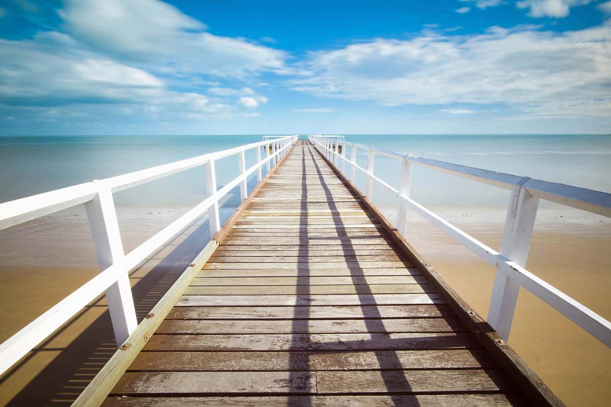 bridge brown and white wooden dock under white clouds boardwalk