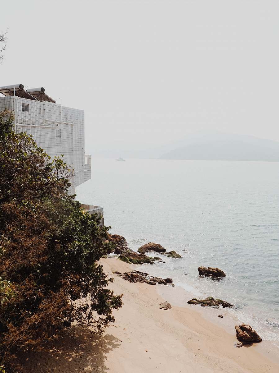 nature white building near body of water hong kong