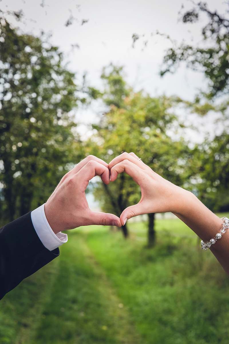 white groom and bridge hand gesture event