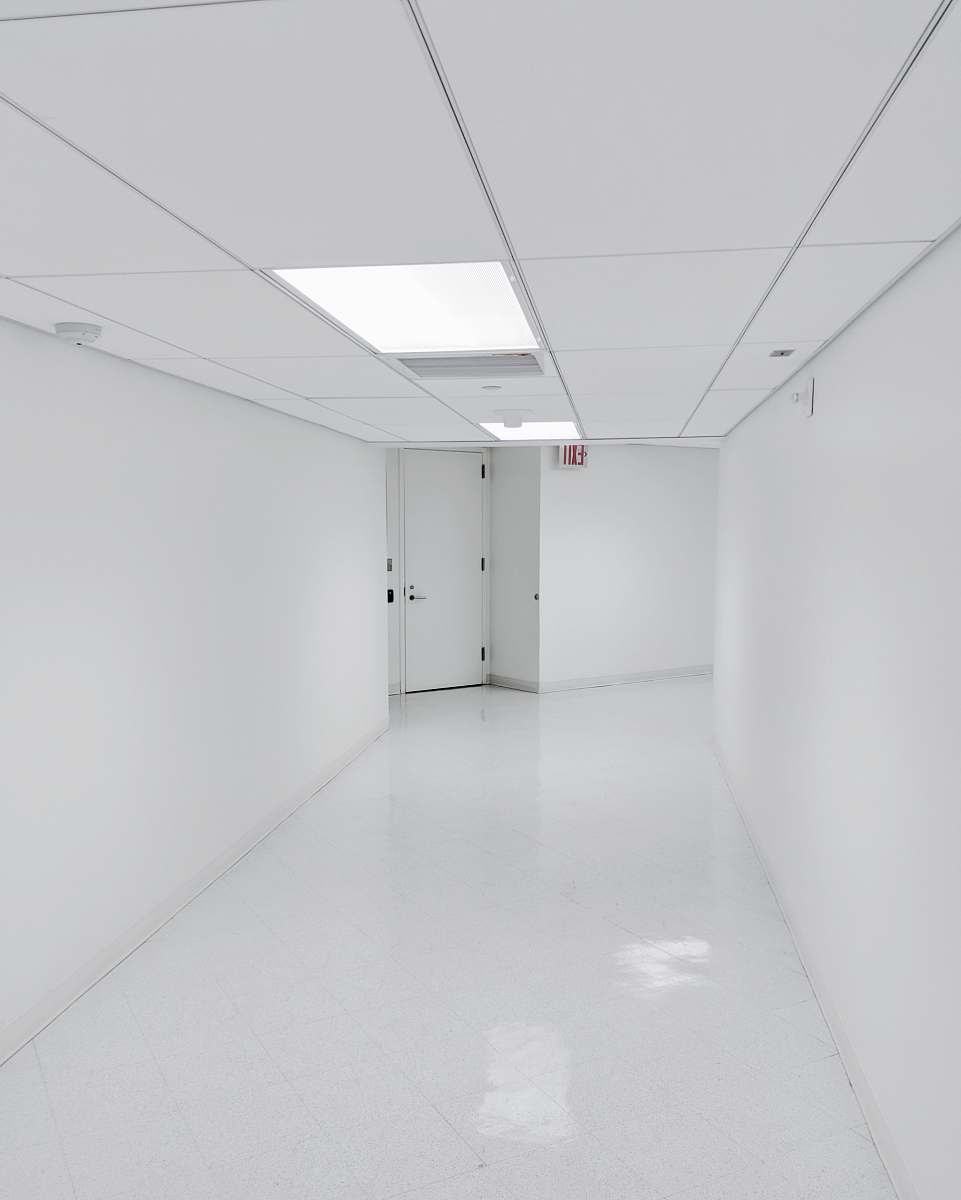 black-and-white empty hallway corridor