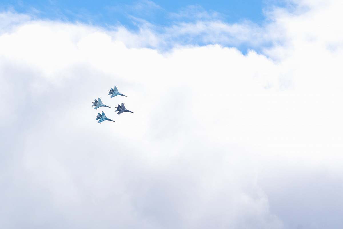 airplane four blue fighting planes surrounded white clouds cloud